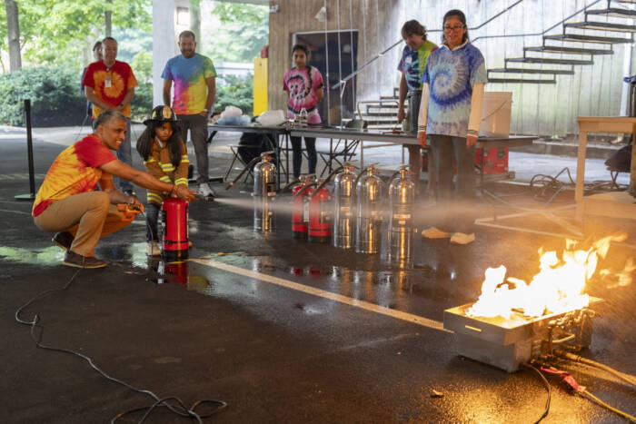 The station led by Rockefeller's lab safety team is always a fan favorite where visitors can learn how to use a fire extinguisher.